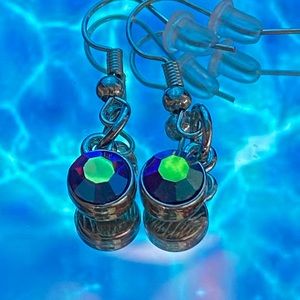 Magenta, blue, and white dangle gem earrings.